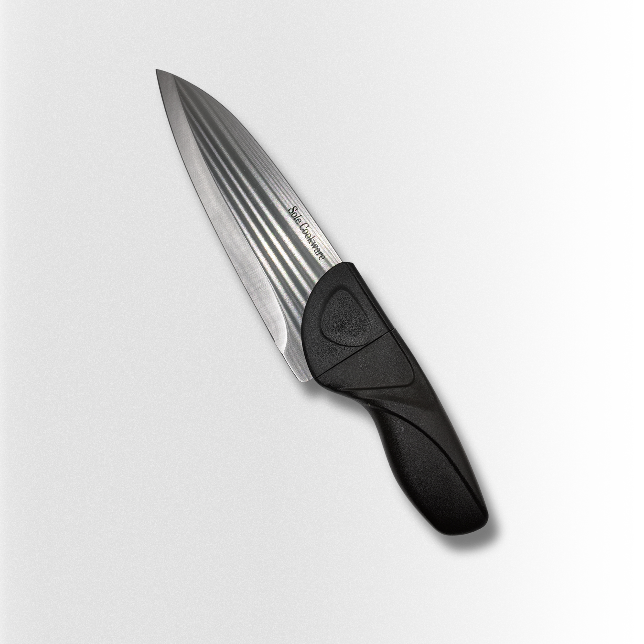 Knife with a black handle on a light gray background
