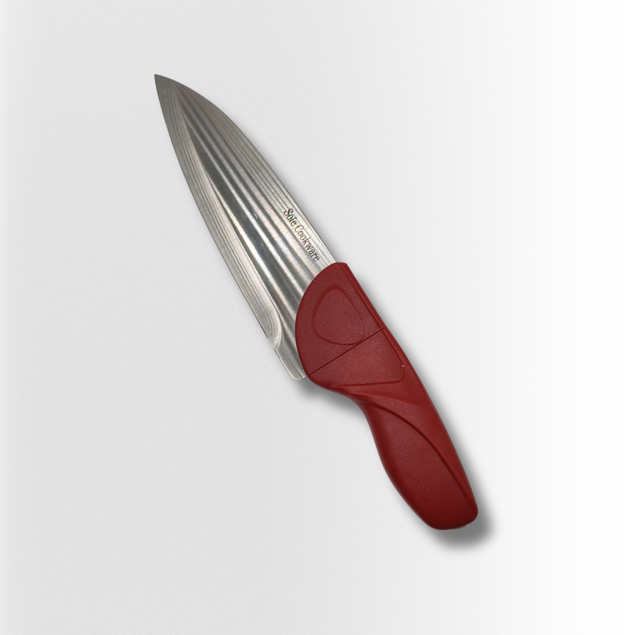 Knife with a red handle on a light gray background