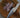 Cream Handle Chef Knife cut shallots thin sliced, on round wood cutting board with handle on marble countertop